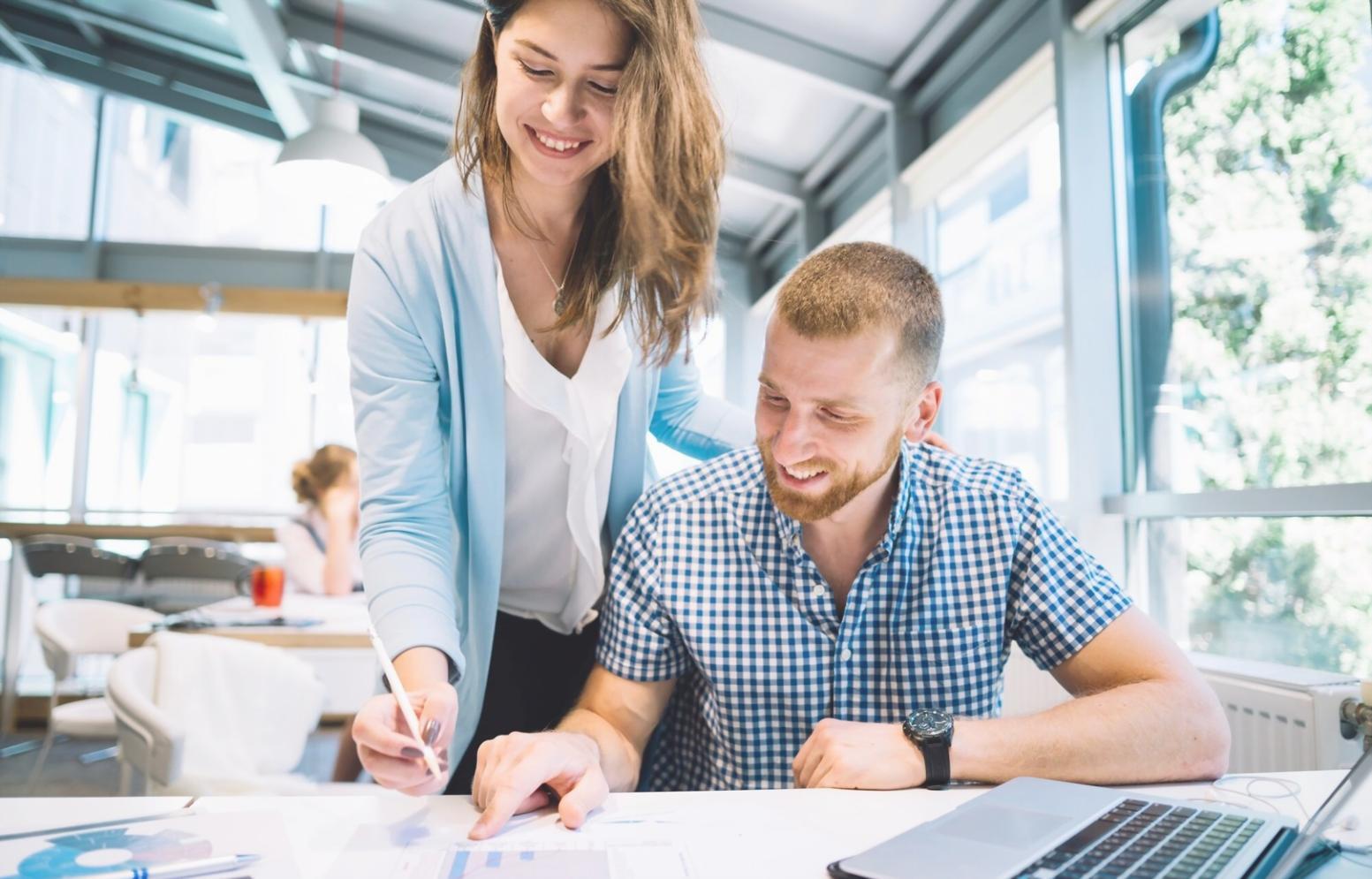 Professional working with financial automation dashboard showing real-time budget tracking and spending analysis